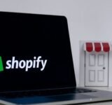 Shopify logo on a laptop screen, a closed shop door.